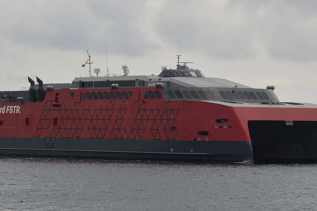 A modern high-speed car ferry crossing open water